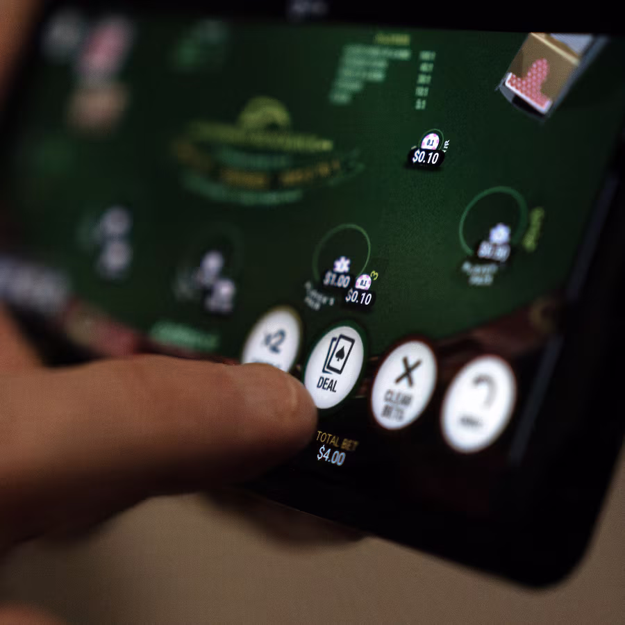 Beaming Bengali lady holding her phone while using the BH 999 betting app in a warm and cozy home spot